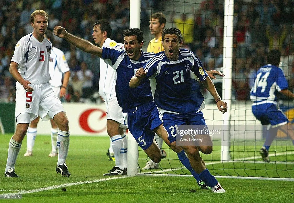 Dellas heads in the infamous silver goal that sent Greece to the final